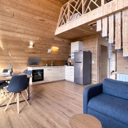 Interior of the Aslan chalet with fitted kitchen, lounge, dining room and mezzanine